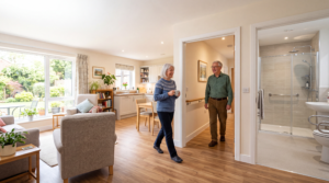 Older couple enjoying a safe, accessible home with grab rails, bright lighting, and step-free access